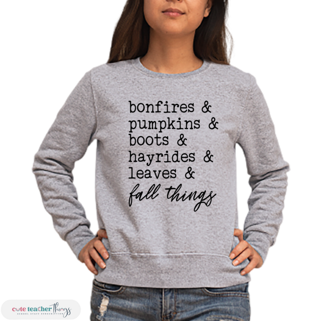bonefires & pumpkins & boots & hayrides & leaves & fall things design heavy blend unisex sweatshirt